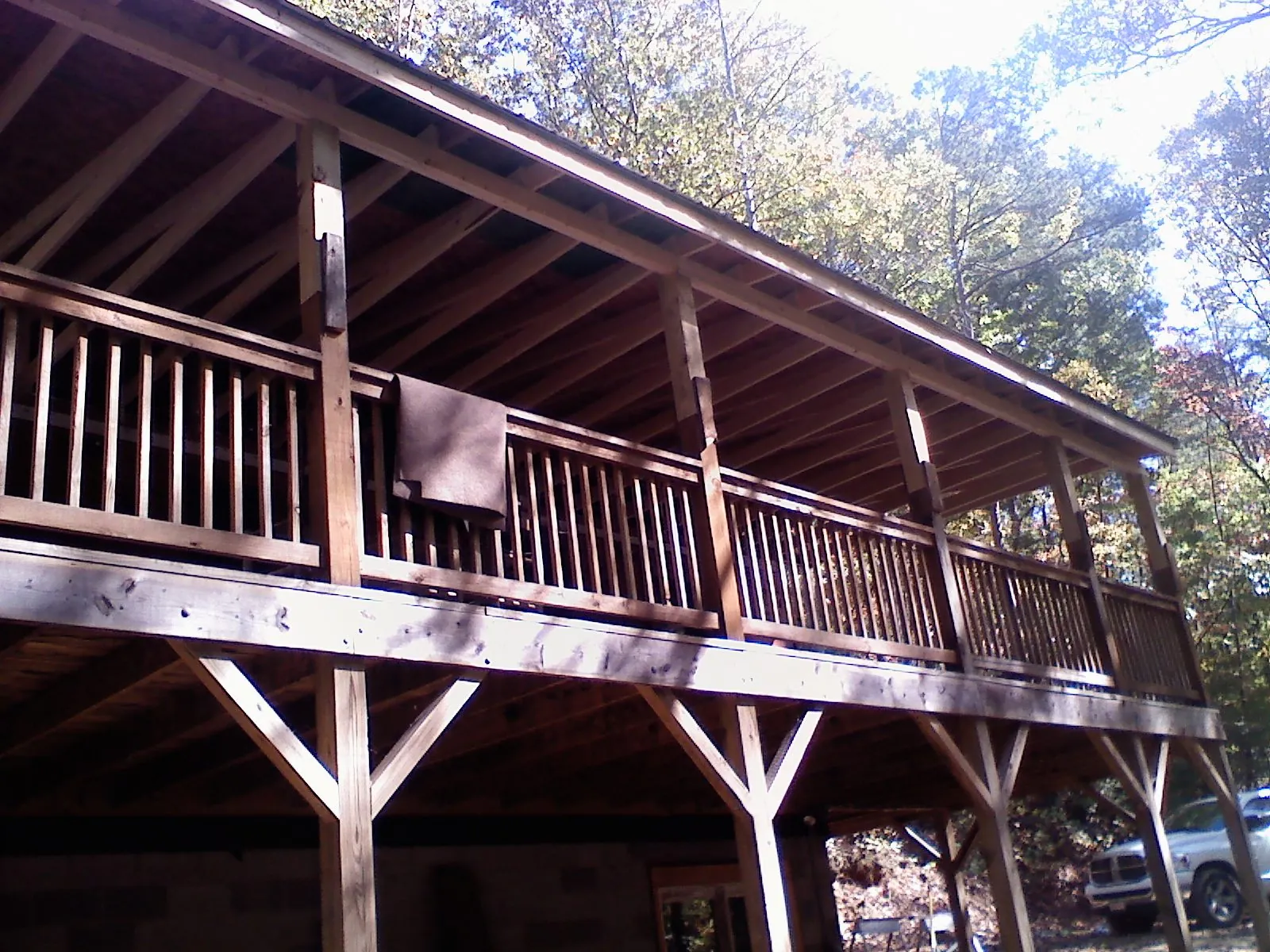 Timber framing under a new elevated porch and deck — Roof Leak Repair in New Oxford by Roofing Brothers